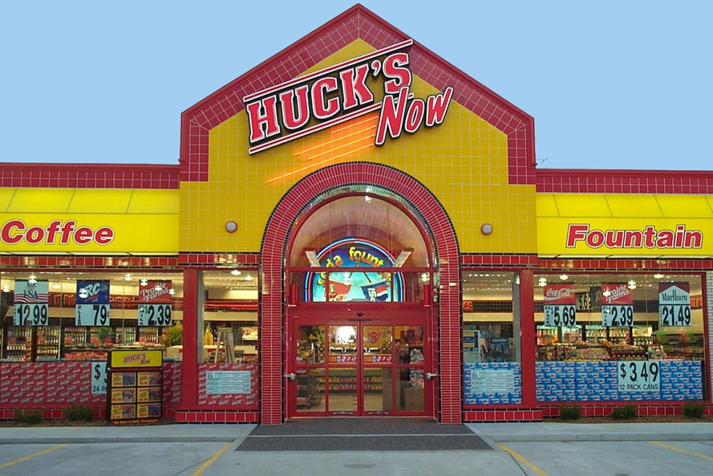 Hucks Storefront Sign with Channel Lettering and Neon